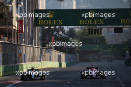 Lewis Hamilton (GBR) Mercedes AMG F1 W08 battle for position with Esteban Ocon (FRA) Sahara Force India F1 VJM10. 25.06.2017. Formula 1 World Championship, Rd 8, Azerbaijan Grand Prix, Baku Street Circuit, Azerbaijan, Race Day.