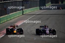 Max Verstappen (NLD) Red Bull Racing RB13 and Sergio Perez (MEX) Sahara Force India F1 VJM10 battle for position. 25.06.2017. Formula 1 World Championship, Rd 8, Azerbaijan Grand Prix, Baku Street Circuit, Azerbaijan, Race Day.