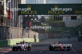 (L to R): Esteban Ocon (FRA) Sahara Force India F1 VJM10 battle for position with Sebastian Vettel (GER) Ferrari SF70H. 25.06.2017. Formula 1 World Championship, Rd 8, Azerbaijan Grand Prix, Baku Street Circuit, Azerbaijan, Race Day.