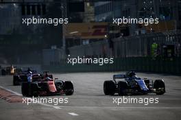 Fernando Alonso (ESP) McLaren MCL32 and Marcus Ericsson (SWE) Sauber C36 battle for position. 25.06.2017. Formula 1 World Championship, Rd 8, Azerbaijan Grand Prix, Baku Street Circuit, Azerbaijan, Race Day.