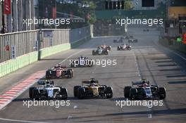 (L to R): Felipe Massa (BRA) Williams FW40 battle for position with Nico Hulkenberg (GER) Renault Sport F1 Team RS17 and Kevin Magnussen (DEN) Haas VF-17. 25.06.2017. Formula 1 World Championship, Rd 8, Azerbaijan Grand Prix, Baku Street Circuit, Azerbaijan, Race Day.