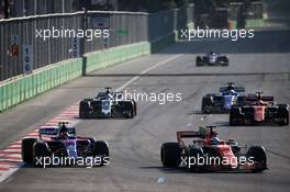 (L to R): Carlos Sainz Jr (ESP) Scuderia Toro Rosso STR12 and Fernando Alonso (ESP) McLaren MCL32 battle for position. 25.06.2017. Formula 1 World Championship, Rd 8, Azerbaijan Grand Prix, Baku Street Circuit, Azerbaijan, Race Day.