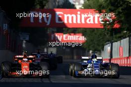 Stoffel Vandoorne (BEL) McLaren F1 and Marcus Ericsson (SWE) Sauber F1 Team  25.06.2017. Formula 1 World Championship, Rd 8, Azerbaijan Grand Prix, Baku Street Circuit, Azerbaijan, Race Day.