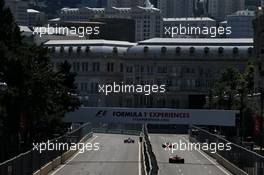 Daniil Kvyat (RUS) Scuderia Toro Rosso STR12 and Kimi Raikkonen (FIN) Ferrari SF70H. 24.06.2017. Formula 1 World Championship, Rd 8, Azerbaijan Grand Prix, Baku Street Circuit, Azerbaijan, Qualifying Day.