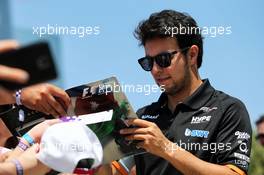 Sergio Perez (MEX) Sahara Force India F1 signs autographs for the fans. 25.06.2017. Formula 1 World Championship, Rd 8, Azerbaijan Grand Prix, Baku Street Circuit, Azerbaijan, Race Day.