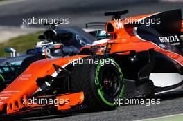 Stoffel Vandoorne (BEL) McLaren MCL32 and Valtteri Bottas (FIN) Mercedes AMG F1 W08. 02.03.2017. Formula One Testing, Day Four, Barcelona, Spain. Thursday.