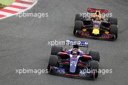 Daniil Kvyat (RUS) Scuderia Toro Rosso STR12 leads Max Verstappen (NLD) Red Bull Racing RB13. 28.02.2017. Formula One Testing, Day Two, Barcelona, Spain. Tuesday.