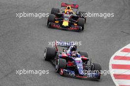 Daniil Kvyat (RUS) Scuderia Toro Rosso STR12 leads Max Verstappen (NLD) Red Bull Racing RB13. 28.02.2017. Formula One Testing, Day Two, Barcelona, Spain. Tuesday.