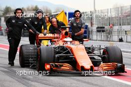 Stoffel Vandoorne (BEL) McLaren MCL32 pushed down the pit lane by mechanics. 28.02.2017. Formula One Testing, Day Two, Barcelona, Spain. Tuesday.