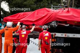 The crashed Ferrari SF70H of Kimi Raikkonen (FIN) Ferrari is recovered back to the pits on the back of a truck. 08.03.2017. Formula One Testing, Day Two, Barcelona, Spain. Wednesday.