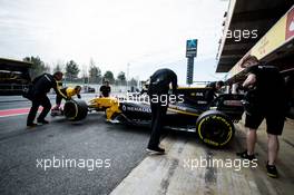 Nico Hulkenberg (GER) Renault Sport F1 Team RS17 pushed back by mechanics in the pits. 08.03.2017. Formula One Testing, Day Two, Barcelona, Spain. Wednesday.