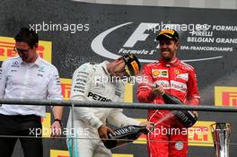 (L to R): Race winner Lewis Hamilton (GBR) Mercedes AMG F1 celebrates with the champagne with second placed Sebastian Vettel (GER) Ferrari. 27.08.2017. Formula 1 World Championship, Rd 12, Belgian Grand Prix, Spa Francorchamps, Belgium, Race Day.
