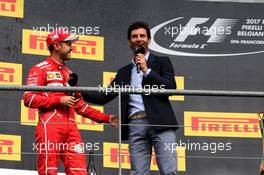 (L to R): Sebastian Vettel (GER) Ferrari with Mark Webber (AUS) Channel 4 Presenter on the podium. 27.08.2017. Formula 1 World Championship, Rd 12, Belgian Grand Prix, Spa Francorchamps, Belgium, Race Day.