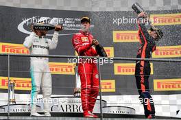 (L to R): Race winner Lewis Hamilton (GBR) Mercedes AMG F1 celebrates with the champagne with second placed Sebastian Vettel (GER) Ferrari and third placed Daniel Ricciardo (AUS) Red Bull Racing. 27.08.2017. Formula 1 World Championship, Rd 12, Belgian Grand Prix, Spa Francorchamps, Belgium, Race Day.