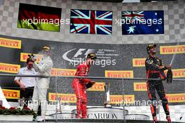 The podium (L to R): Race winner Lewis Hamilton (GBR) Mercedes AMG F1 celebrates with the champagne with Sebastian Vettel (GER) Ferrari and Daniel Ricciardo (AUS) Red Bull Racing. 27.08.2017. Formula 1 World Championship, Rd 12, Belgian Grand Prix, Spa Francorchamps, Belgium, Race Day.