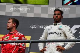(L to R): Second placed Sebastian Vettel (GER) Ferrari on the podium with race winner Lewis Hamilton (GBR) Mercedes AMG F1. 27.08.2017. Formula 1 World Championship, Rd 12, Belgian Grand Prix, Spa Francorchamps, Belgium, Race Day.