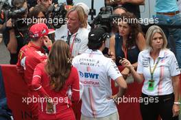 (L to R): Sebastian Vettel (GER) Ferrari and Sergio Perez (MEX) Sahara Force India F1 with the media. 27.08.2017. Formula 1 World Championship, Rd 12, Belgian Grand Prix, Spa Francorchamps, Belgium, Race Day.