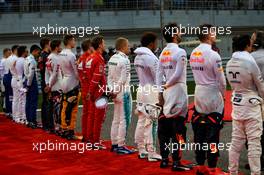 Drivers as the grid observes the national anthem. 16.04.2017. Formula 1 World Championship, Rd 3, Bahrain Grand Prix, Sakhir, Bahrain, Race Day.