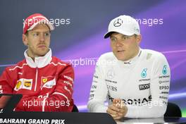(L to R): Sebastian Vettel (GER) Ferrari and Valtteri Bottas (FIN) Mercedes AMG F1 in the FIA Press Conference. 16.04.2017. Formula 1 World Championship, Rd 3, Bahrain Grand Prix, Sakhir, Bahrain, Race Day.