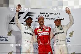 The podium (L to R): Lewis Hamilton (GBR) Mercedes AMG F1, second; Sebastian Vettel (GER) Ferrari, race winner; Valtteri Bottas (FIN) Mercedes AMG F1, third. 16.04.2017. Formula 1 World Championship, Rd 3, Bahrain Grand Prix, Sakhir, Bahrain, Race Day.