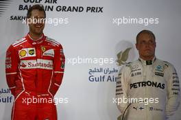 1st place Sebastian Vettel (GER) Ferrari SF70H and 3rd place Valtteri Bottas (FIN) Mercedes AMG F1 W08. 16.04.2017. Formula 1 World Championship, Rd 3, Bahrain Grand Prix, Sakhir, Bahrain, Race Day.