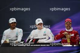 The post qualifying FIA Press Conference (L to R): Lewis Hamilton (GBR) Mercedes AMG F1; Valtteri Bottas (FIN) Mercedes AMG F1; Sebastian Vettel (GER) Ferrari. 15.04.2017. Formula 1 World Championship, Rd 3, Bahrain Grand Prix, Sakhir, Bahrain, Qualifying Day.