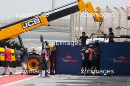 The Scuderia Toro Rosso STR12 of Sean Gelael (IDN) Scuderia Toro Rosso Test Driver is recovered back to the pits. 18.04.2017. Formula 1 Testing. Sakhir, Bahrain. Tuesday.