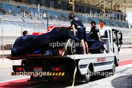 The Scuderia Toro Rosso STR12 of Sean Gelael (IDN) Scuderia Toro Rosso Test Driver is recovered back to the pits on the back of a truck. 18.04.2017. Formula 1 Testing. Sakhir, Bahrain. Tuesday.