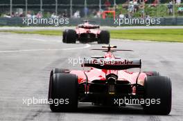 Kimi Raikkonen (FIN) Ferrari SF70H and Sebastian Vettel (GER) Ferrari SF70H at the pit lane exit. 09.06.2017. Formula 1 World Championship, Rd 7, Canadian Grand Prix, Montreal, Canada, Practice Day.