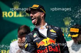 Daniel Ricciardo (AUS) Red Bull Racing celebrates his third position with the champagne on the podium. 11.06.2017. Formula 1 World Championship, Rd 7, Canadian Grand Prix, Montreal, Canada, Race Day.