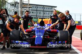 Scuderia Toro Rosso STR12 pushed down the pit lane. 08.06.2017. Formula 1 World Championship, Rd 7, Canadian Grand Prix, Montreal, Canada, Preparation Day.