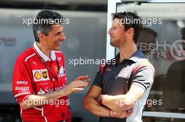 (L to R): Claudio Albertini (ITA) Ferrari Head of Customer Teams Power Unit Operations with Romain Grosjean (FRA) Haas F1 Team. 08.06.2017. Formula 1 World Championship, Rd 7, Canadian Grand Prix, Montreal, Canada, Preparation Day.