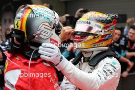 Sebastian Vettel (GER) Scuderia Ferrari and Lewis Hamilton (GBR) Mercedes AMG F1   09.04.2017. Formula 1 World Championship, Rd 2, Chinese Grand Prix, Shanghai, China, Race Day.