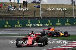 Sebastian Vettel (GER) Ferrari SF70H passes Max Verstappen (NLD) Red Bull Racing RB13, who ran wide. 09.04.2017. Formula 1 World Championship, Rd 2, Chinese Grand Prix, Shanghai, China, Race Day.