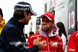 (L to R): Antonio Giovinazzi (ITA) Sauber F1 Team with Sebastian Vettel (GER) Ferrari on the drivers parade. 09.04.2017. Formula 1 World Championship, Rd 2, Chinese Grand Prix, Shanghai, China, Race Day.