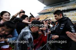 Esteban Ocon (FRA) Sahara Force India F1 Team signs autographs for the fans. 06.04.2017. Formula 1 World Championship, Rd 2, Chinese Grand Prix, Shanghai, China, Preparation Day.
