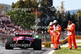 Sebastian Vettel (GER) Ferrari SF70H is pushed back to the pits by mechanics after stopping in the first practice session. 12.05.2017. Formula 1 World Championship, Rd 5, Spanish Grand Prix, Barcelona, Spain, Practice Day.