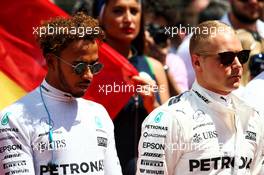 (L to R): Lewis Hamilton (GBR) Mercedes AMG F1 and Valtteri Bottas (FIN) Mercedes AMG F1 as the grid observes the national anthem. 14.05.2017. Formula 1 World Championship, Rd 5, Spanish Grand Prix, Barcelona, Spain, Race Day.