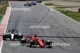 Sebastian Vettel (GER) Ferrari SF70H leads Lewis Hamilton (GBR) Mercedes AMG F1 W08. 14.05.2017. Formula 1 World Championship, Rd 5, Spanish Grand Prix, Barcelona, Spain, Race Day.