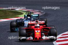 Sebastian Vettel (GER) Ferrari SF70H leads Valtteri Bottas (FIN) Mercedes AMG F1 W08. 14.05.2017. Formula 1 World Championship, Rd 5, Spanish Grand Prix, Barcelona, Spain, Race Day.