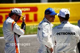 (L to R): Fernando Alonso (ESP) McLaren with Valtteri Bottas (FIN) Mercedes AMG F1 and Lewis Hamilton (GBR) Mercedes AMG F1 on the main straight after qualifying. 13.05.2017. Formula 1 World Championship, Rd 5, Spanish Grand Prix, Barcelona, Spain, Qualifying Day.