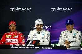 Qualifying top three in the FIA Press Conference (L to R): Sebastian Vettel (GER) Ferrari, second; Lewis Hamilton (GBR) Mercedes AMG F1, pole position; Valtteri Bottas (FIN) Mercedes AMG F1, third. 13.05.2017. Formula 1 World Championship, Rd 5, Spanish Grand Prix, Barcelona, Spain, Qualifying Day.
