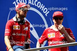 (L to R): Sebastian Vettel (GER) Ferrari and Kimi Raikkonen (FIN) Ferrari on the drivers parade. 14.05.2017. Formula 1 World Championship, Rd 5, Spanish Grand Prix, Barcelona, Spain, Race Day.