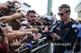 Daniil Kvyat (RUS) Scuderia Toro Rosso signs autographs for the fans. 11.05.2017. Formula 1 World Championship, Rd 5, Spanish Grand Prix, Barcelona, Spain, Preparation Day.