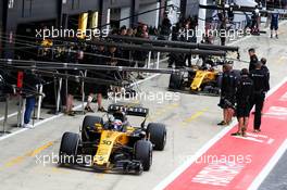 Jolyon Palmer (GBR) Renault Sport F1 Team RS17 and Nico Hulkenberg (GER) Renault Sport F1 Team RS17 in the pits. 14.07.2017. Formula 1 World Championship, Rd 10, British Grand Prix, Silverstone, England, Practice Day.