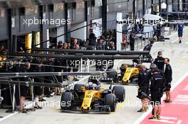 Jolyon Palmer (GBR) Renault Sport F1 Team RS17 and Nico Hulkenberg (GER) Renault Sport F1 Team RS17 in the pits. 14.07.2017. Formula 1 World Championship, Rd 10, British Grand Prix, Silverstone, England, Practice Day.