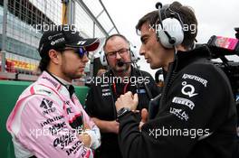 (L to R): Sergio Perez (MEX) Sahara Force India F1 with Tom McCullough (GBR) Sahara Force India F1 Team Chief Engineer and Tim Wright (GBR) Sahara Force India F1 Team Race Engineer on the grid. 16.07.2017. Formula 1 World Championship, Rd 10, British Grand Prix, Silverstone, England, Race Day.