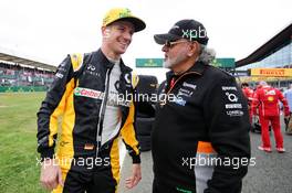 (L to R): Nico Hulkenberg (GER) Renault Sport F1 Team with Dr. Vijay Mallya (IND) Sahara Force India F1 Team Owner on the grid. 16.07.2017. Formula 1 World Championship, Rd 10, British Grand Prix, Silverstone, England, Race Day.
