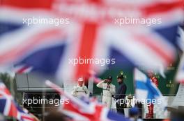 Race winner Lewis Hamilton (GBR) Mercedes AMG F1 on the podium with Owen Wilson (USA) Actor. 16.07.2017. Formula 1 World Championship, Rd 10, British Grand Prix, Silverstone, England, Race Day.
