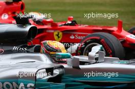 Sebastian Vettel (GER) Ferrari SF70H and Lewis Hamilton (GBR) Mercedes AMG F1 W08. 15.07.2017. Formula 1 World Championship, Rd 10, British Grand Prix, Silverstone, England, Qualifying Day.